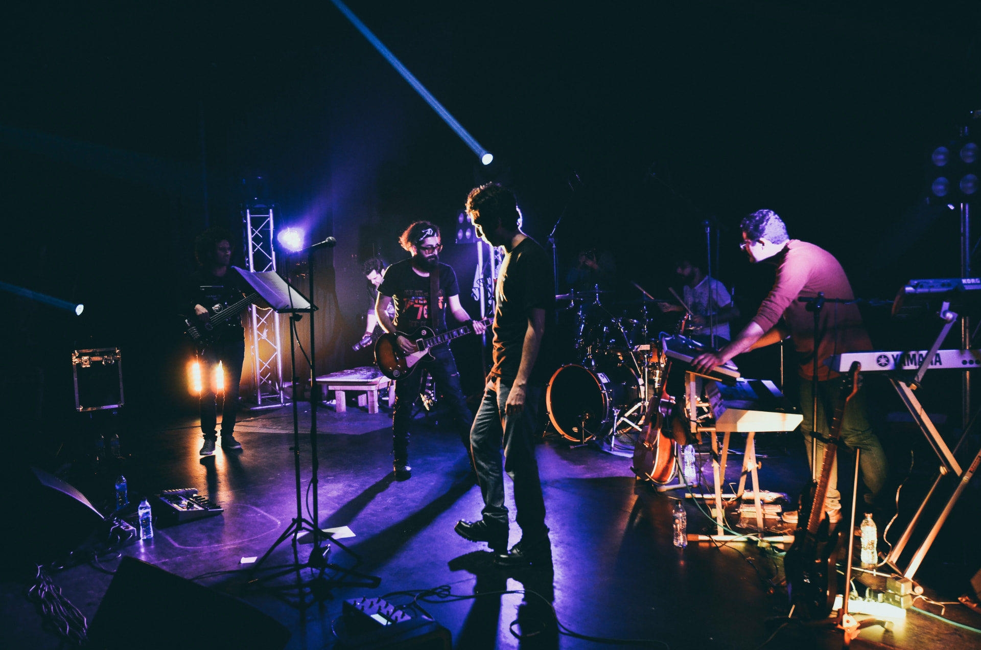 Band performing on a dark stage